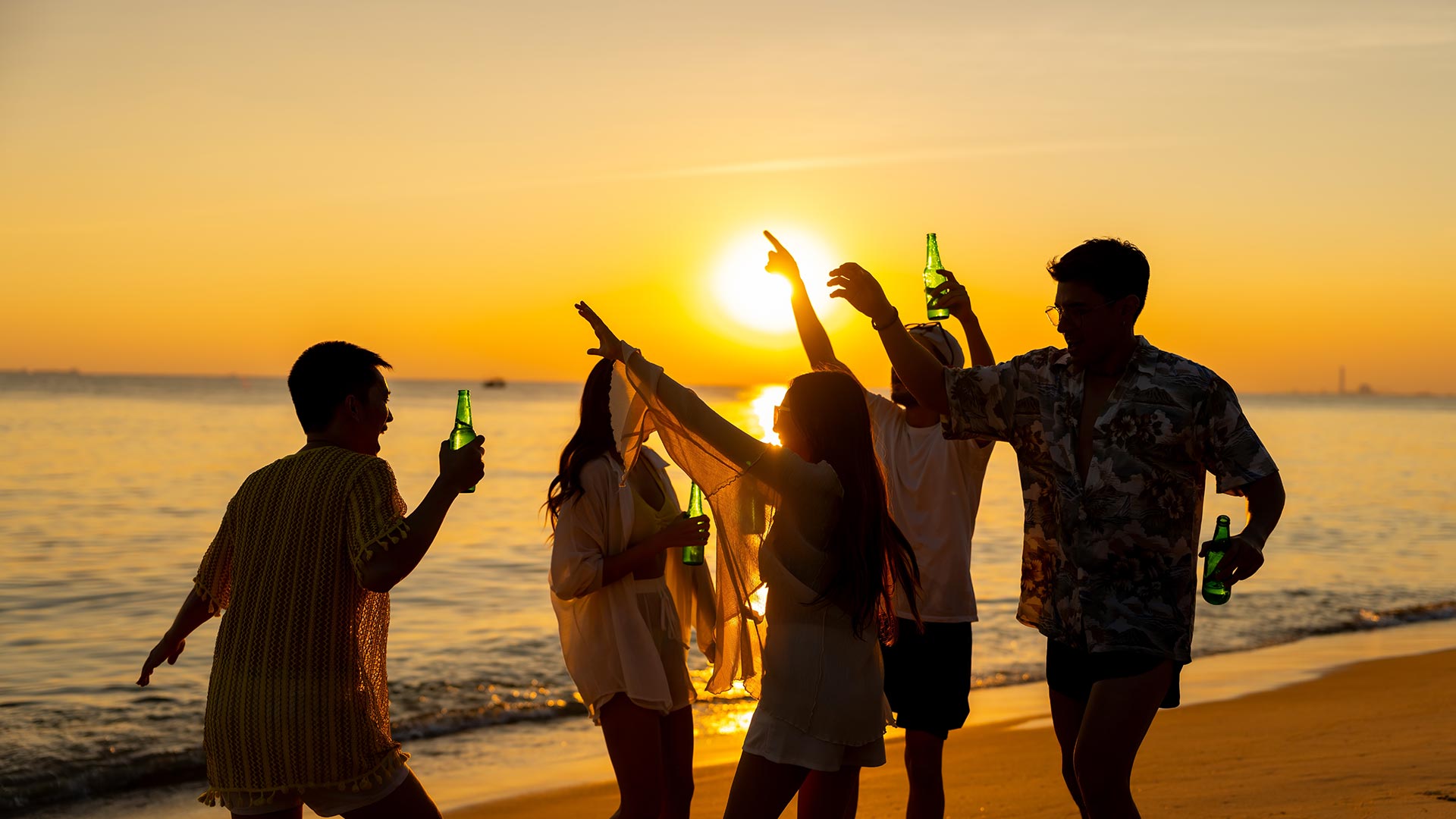 People jumping on the beach