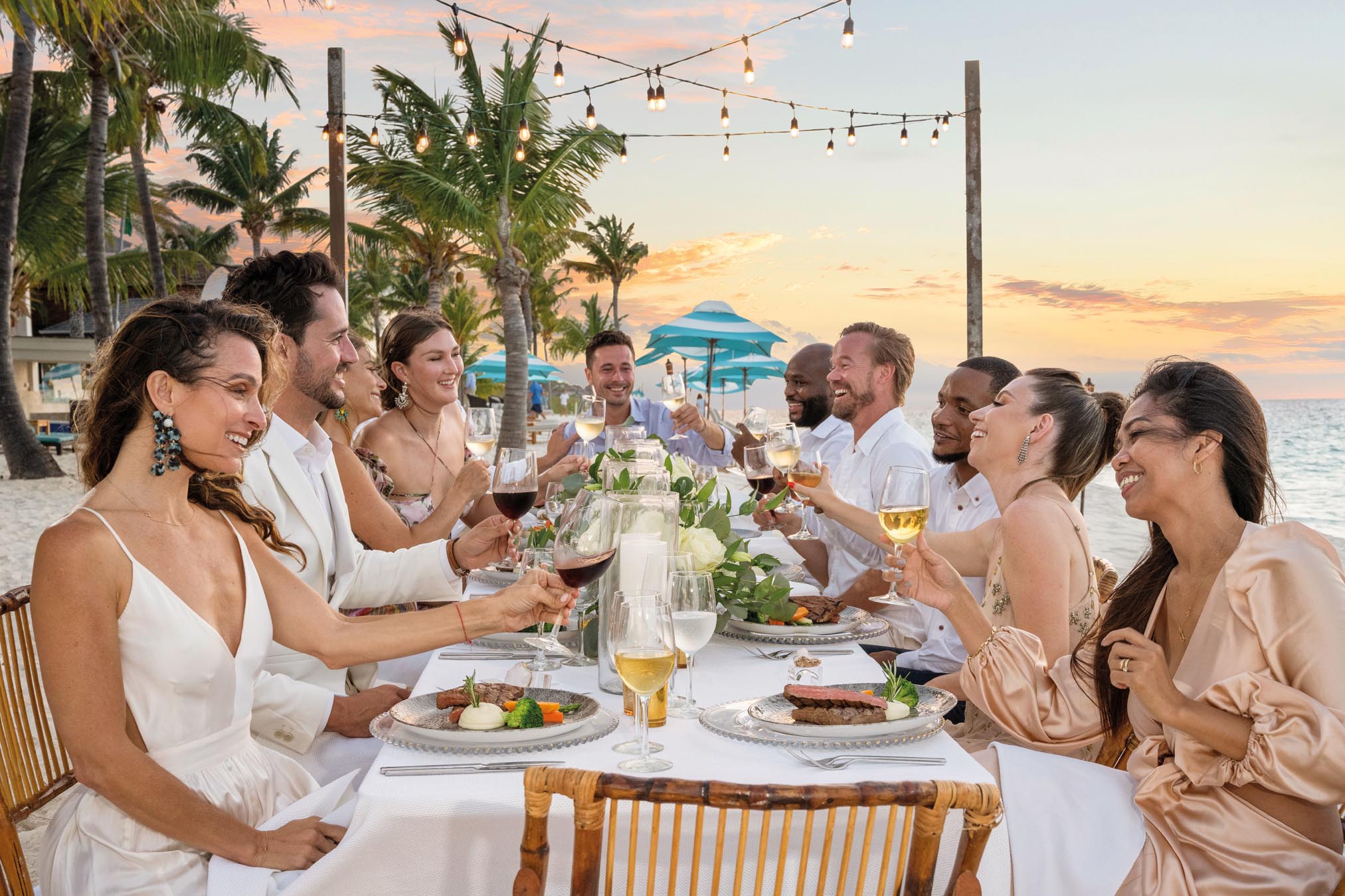 Group of people dining outside on beach