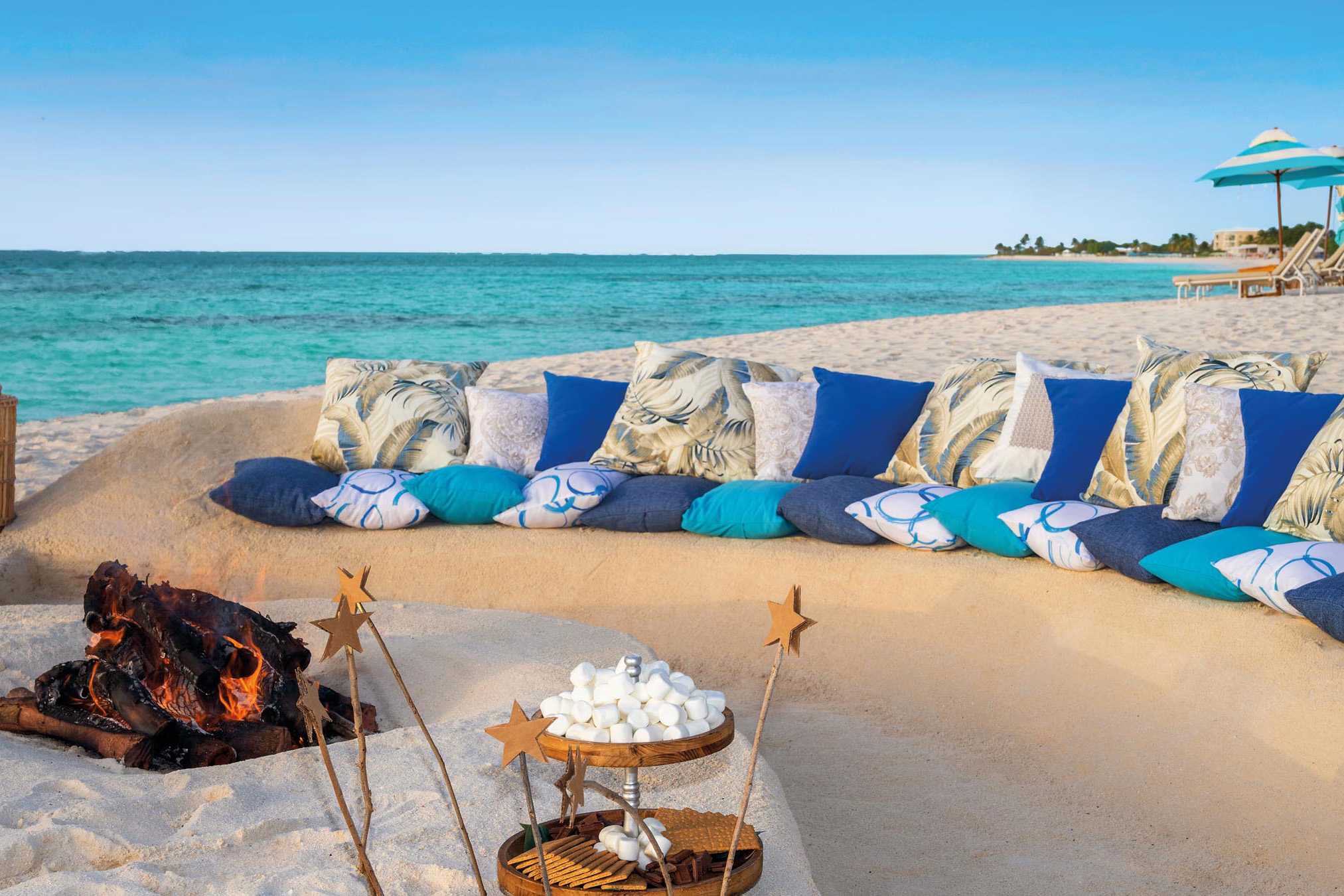 Beach seating with cushions and smore station