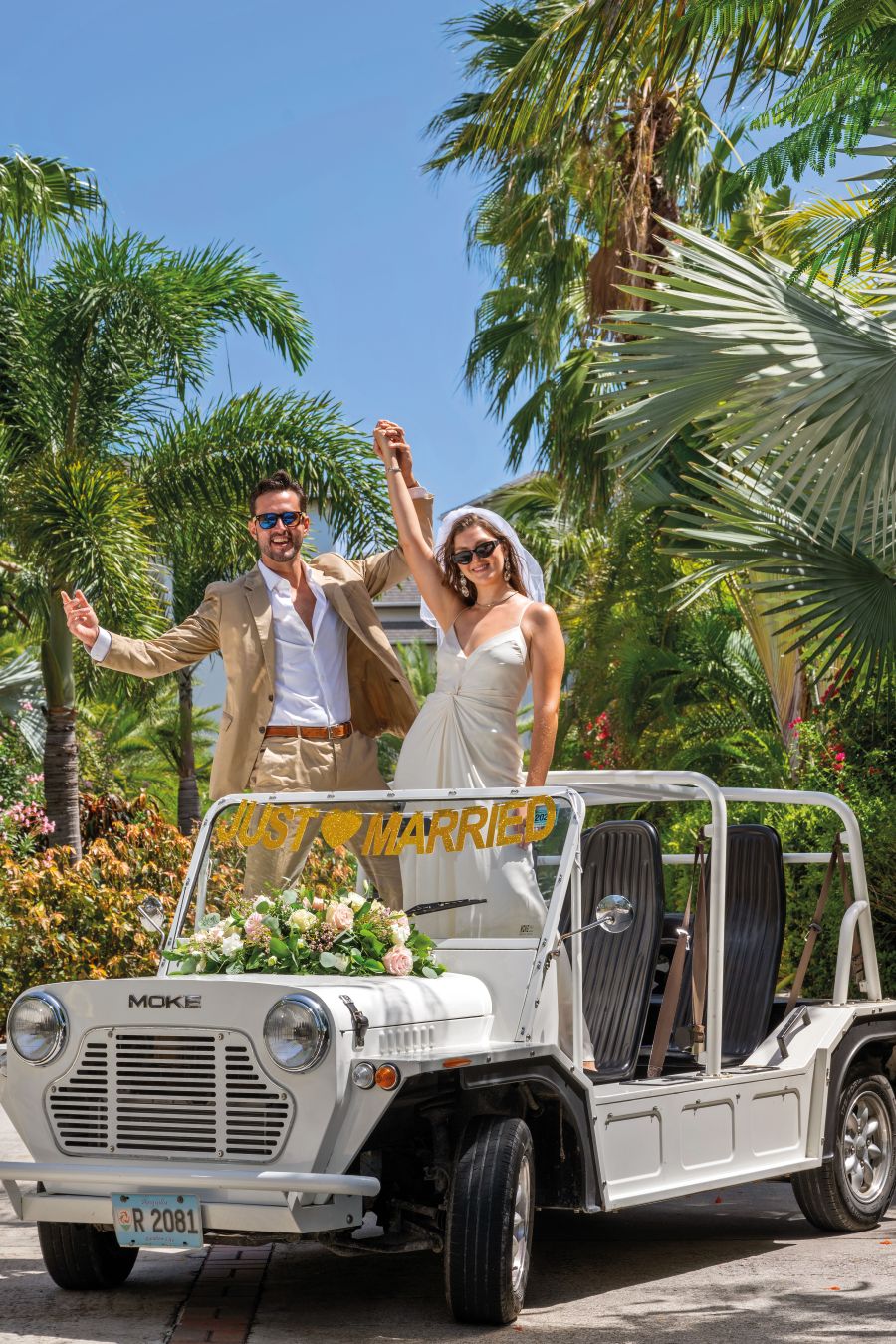 bride and groom in car