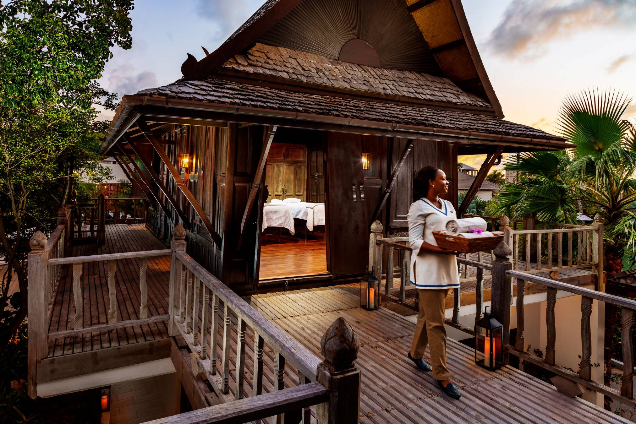 Woman in front of thai house spa